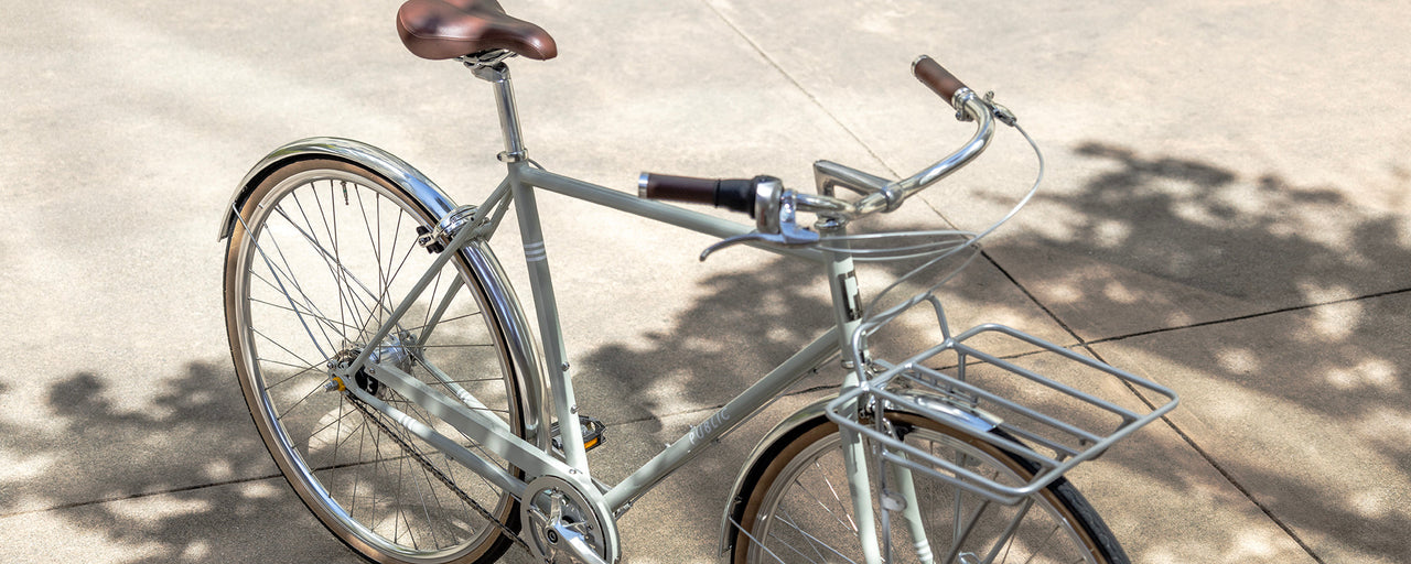 A man on PUBLIC men's bikes, men's city bikes and commuter bicycles.